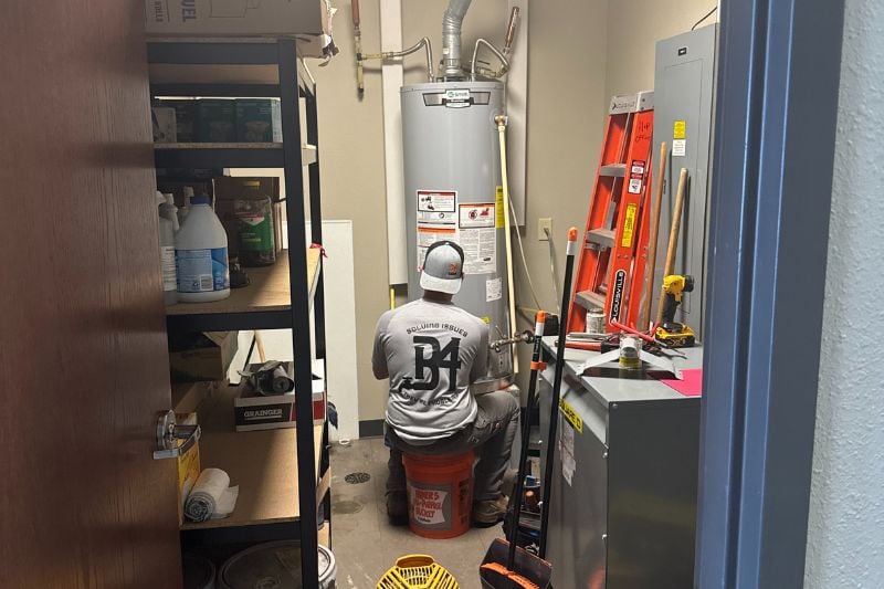 B4 Plumbing and Mechanical technician providing HVAC service in an Oklahoma City business